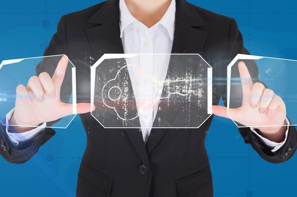 Man holding up an image of a key